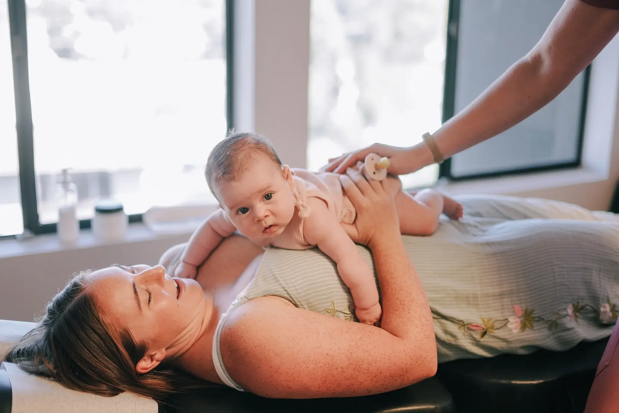 A gentle prenatal adjustment on pregnant patient of Chiropractor in San Diego