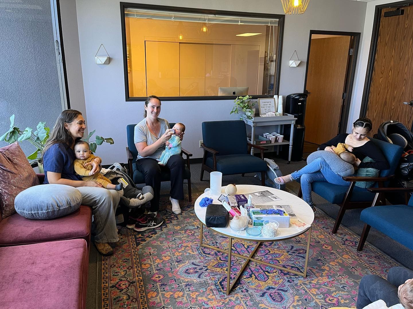 Breastfeeding support group in San Diego — mothers with infants in a warm, supportive setting for lactation and feeding help