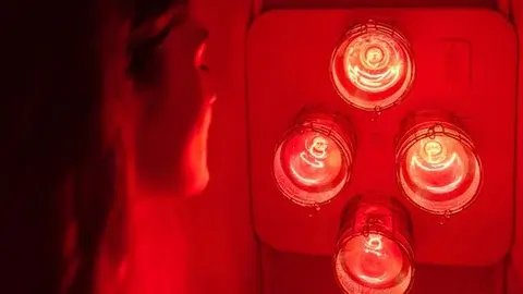 Interior of a near-infrared sauna with wooden benches.